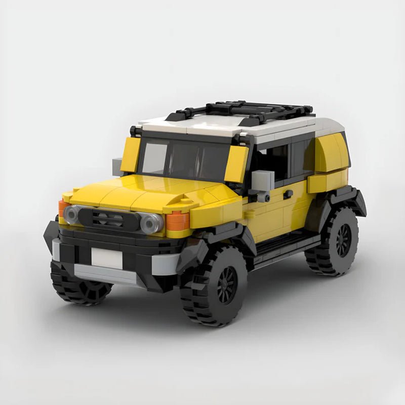 Yellow and white LEGO Toyota FJ Cruiser model with off-road tires on white background