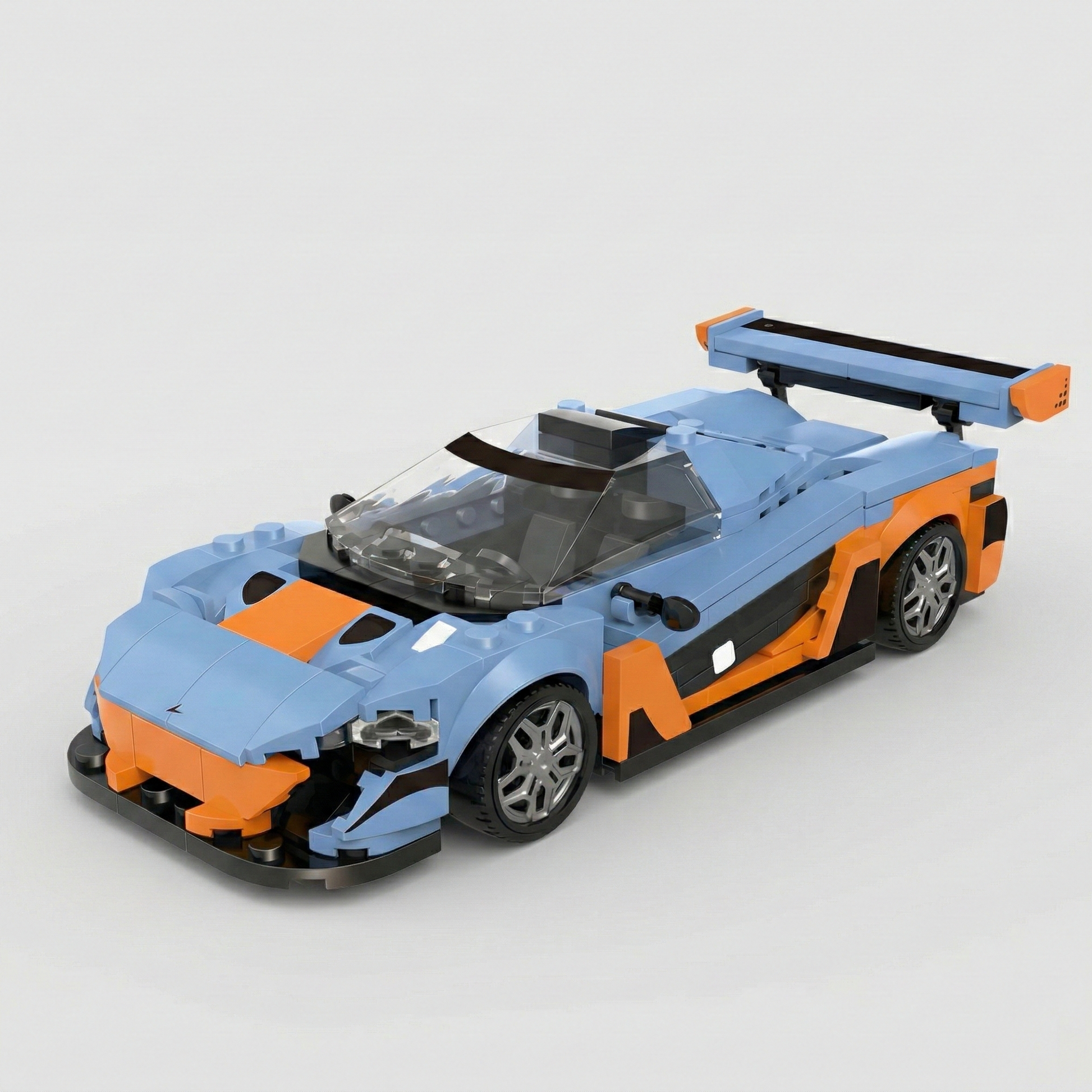 McLaren P1 toy car by RevvBlox in sleek design with detailed bodywork and vibrant colors on a white background.
